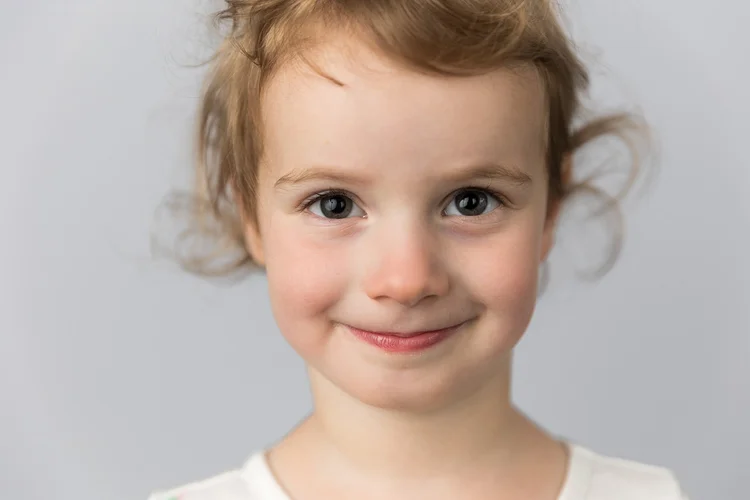 Close-up school portrait against a light gray backdrop