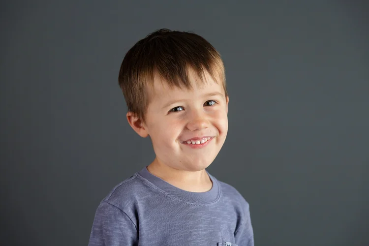 Sample school portrait on a dark-grey background