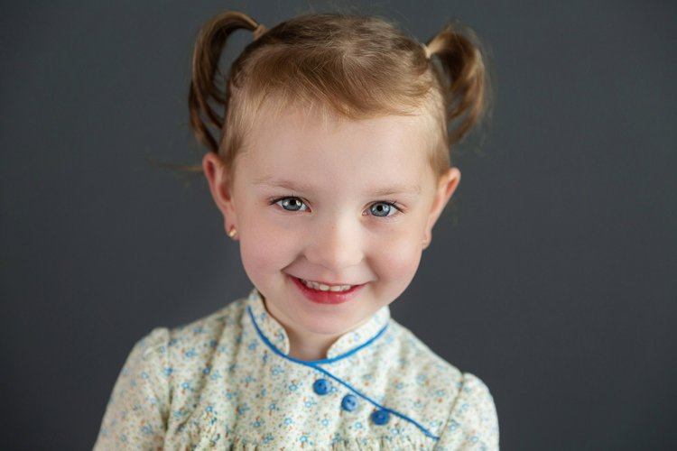 Sample school portrait on a dark-grey background