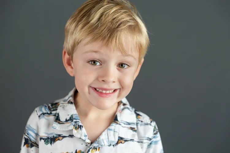 Sample school portrait on a dark-grey background