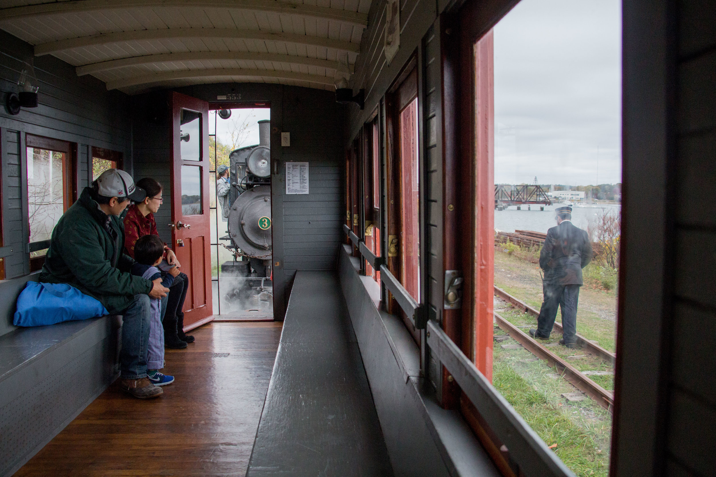  Passengers and Volunteers take the last ride of the 2017 season on the Maine Narrow Gauge Railroad’s train in Portland, Maine on October 29, 2017. 