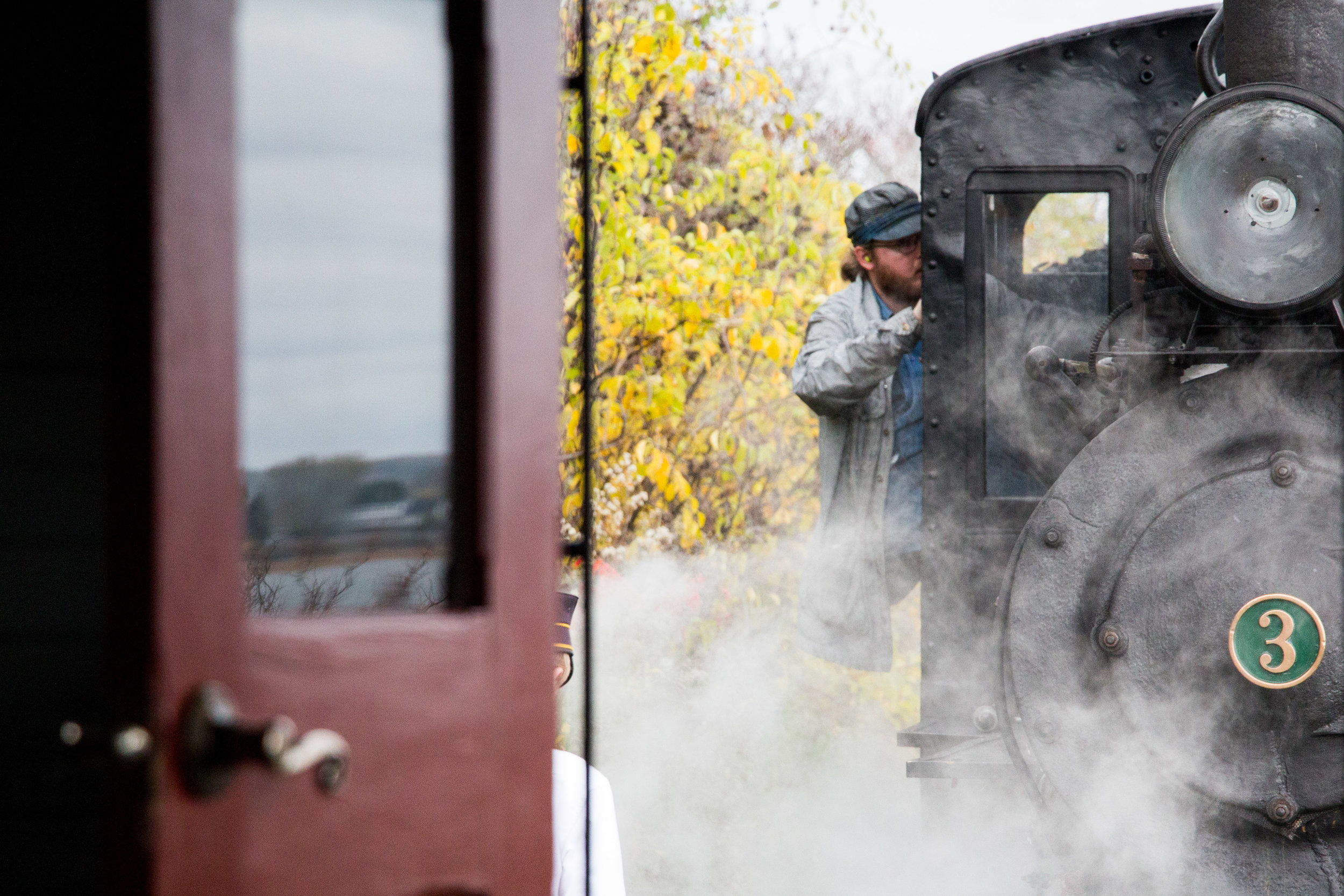  Passengers and Volunteers take the last ride of the 2017 season on the Maine Narrow Gauge Railroad’s train in Portland, Maine on October 29, 2017. 