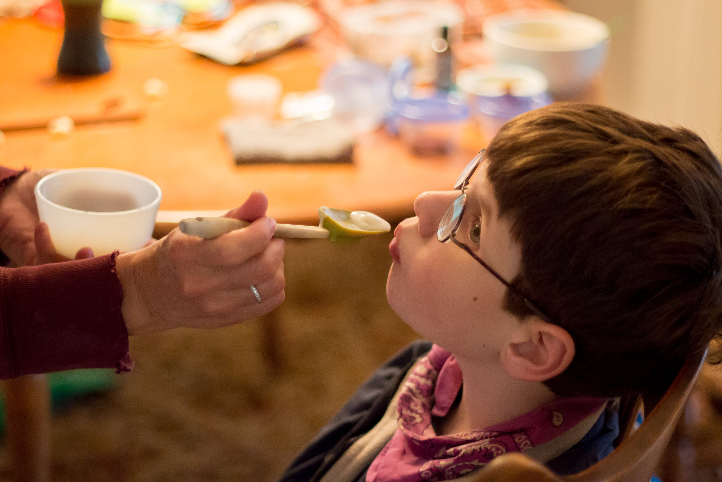  Christy Shake feeds her son Calvin his afternoon dose of cannabis oil mixed with yogurt on October 8, 2017. Christy purchases the cannabis and then takes the plant matter through a lengthy process to create a resin which she then suspends in oil. Sh