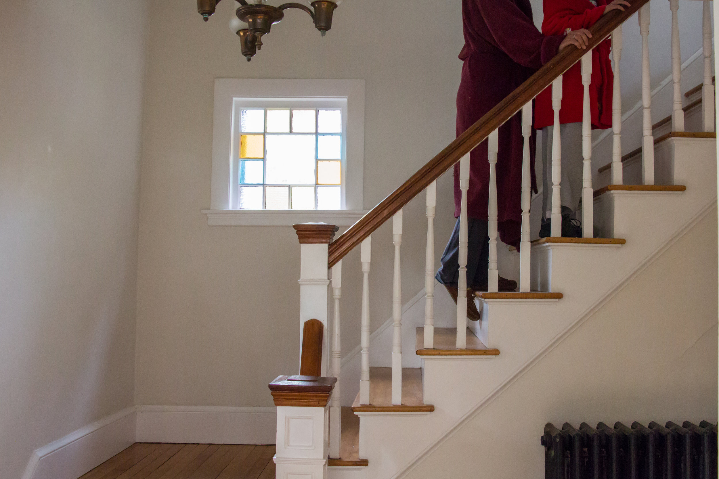  Christy Shake walks behind her son Calvin up the stairs in their home in Brunswick, Maine on September 30, 2017. Though Calvin can walk on his own now, his balance and vision are not good, and he can easily fall without Christy nearby to catch him. 