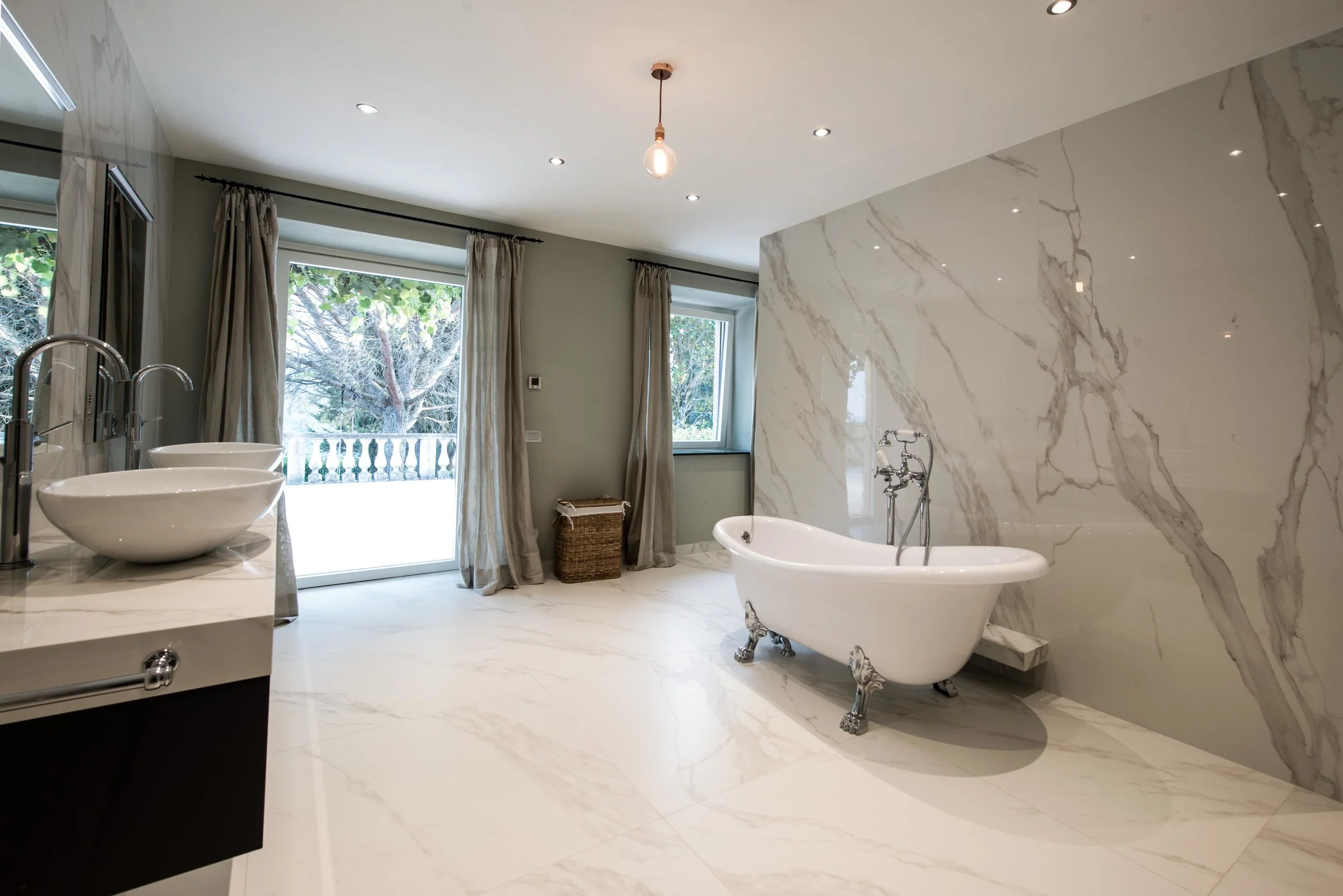  The master ensuite bathroom is the epitome of luxury with a large freestanding clawfoot bath, rainforest shower and double basins with ample storage. 
