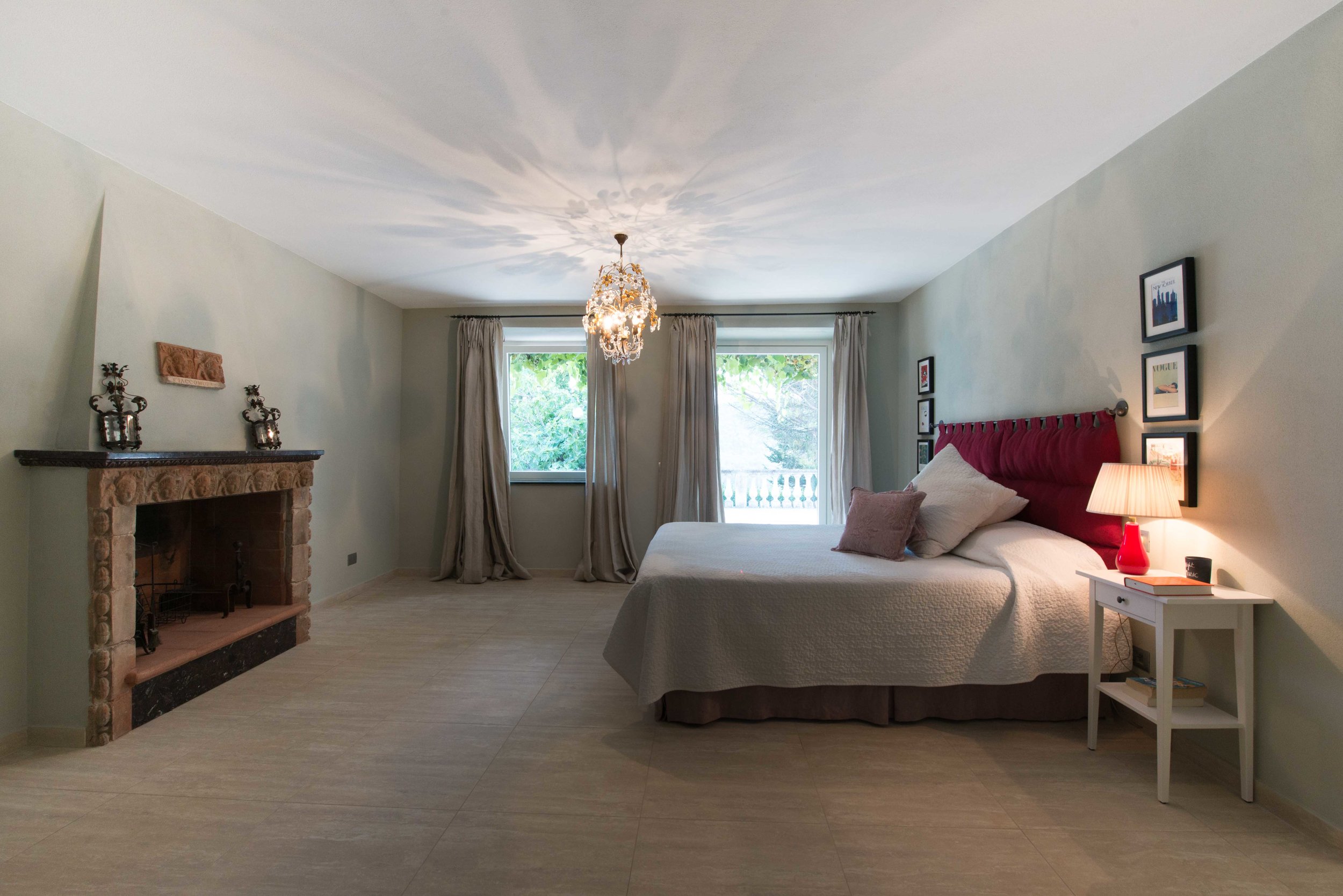  The grand master suite has direct access to the terrace and an antique stone fireplace which has been restored with deep Burgundy marble and brilliant copper. 