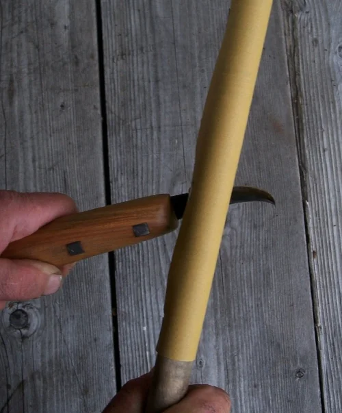 Repeat on the left bevel. Repeat the process with at least 2 more finer grades of sandpaper tight on dowel.