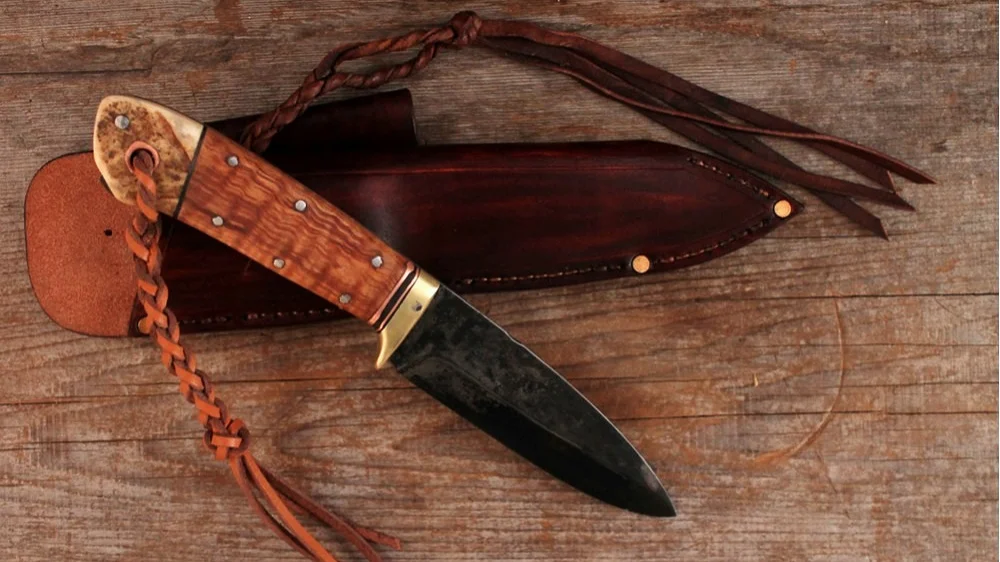 Custom handmade bushcraft knife. Scandi edge.