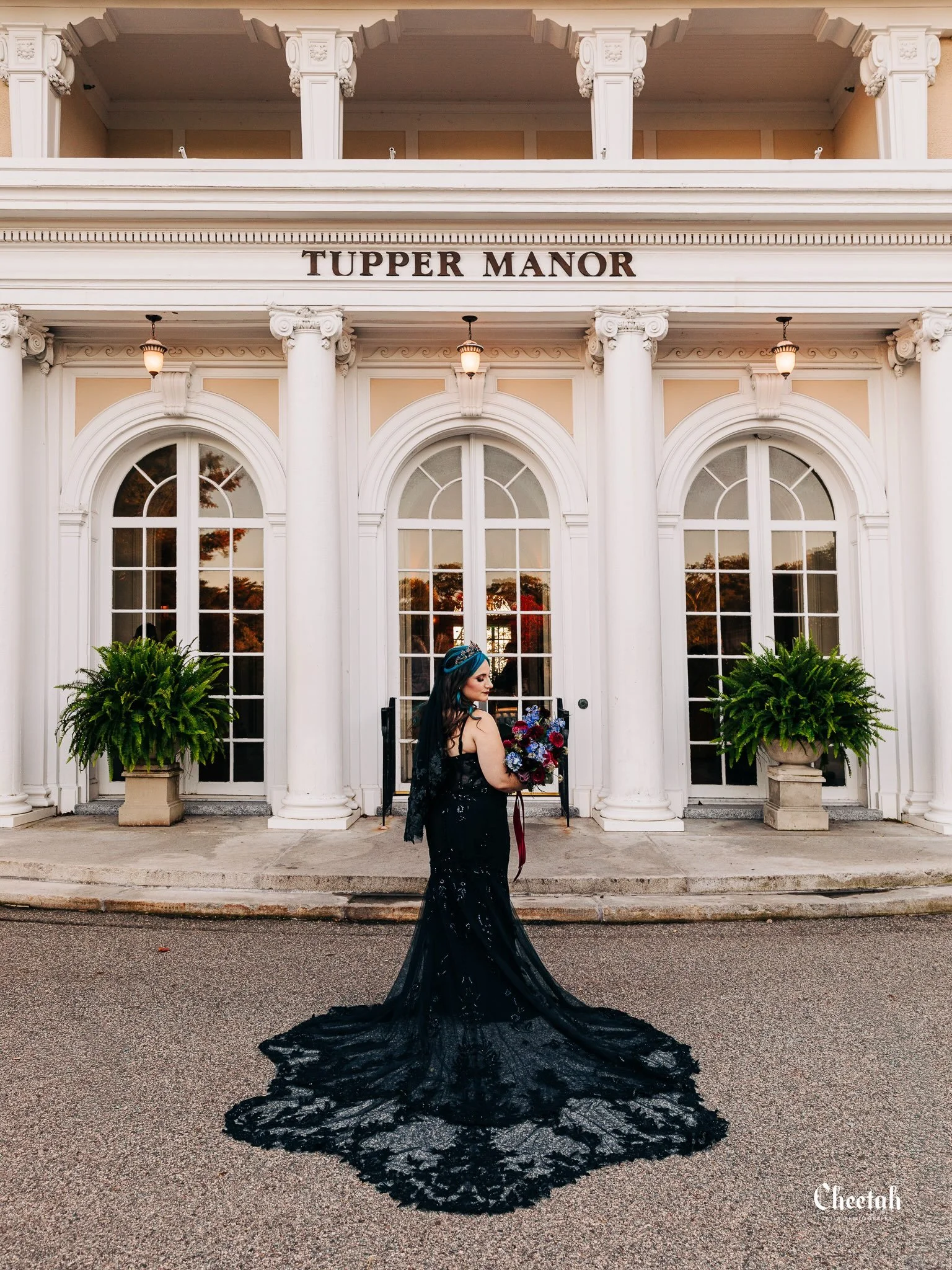 Something about a bride in black against the elegance of Tupper Manor just hits differently. 🖤 Dramatic lace, jewel-toned florals, and a little blue-haired magic made this one impossible not to photograph.

#CheetahDJPhotography #MassachusettsWeddin