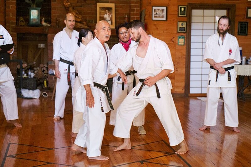 Master Noguchi instructing Peter Zarb at a karate camp