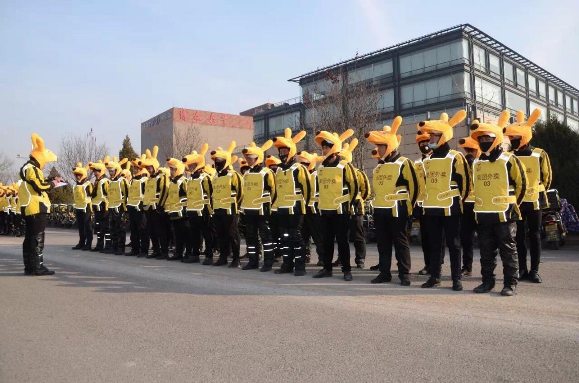 Meituan drivers line up for their daily briefing. Photo: Tech.Huanqiu