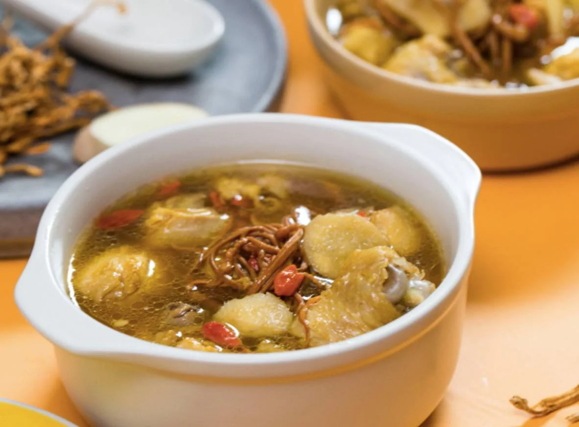 A seemingly oily chicken soup with the addition of goji berries. Photo: Sohu