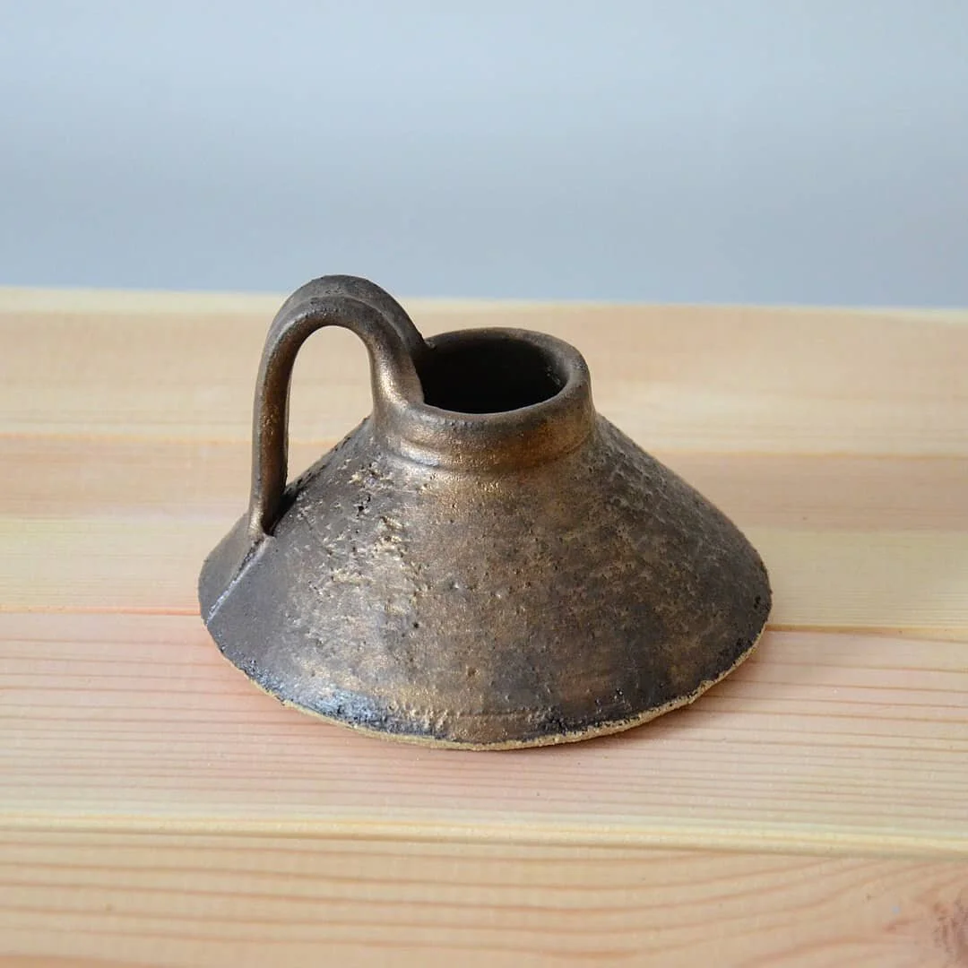 Matt black candle holder. @tereza.kraus and I have just updated our Etsy shop. Link is in bio. 
.
.
.
.
.
.
#pottery #ceramics #clay #candleholder #handbuiltpottery #handmade #made #handmadeceramics #etsy #functional #mattblack #blackandgold #shop #d