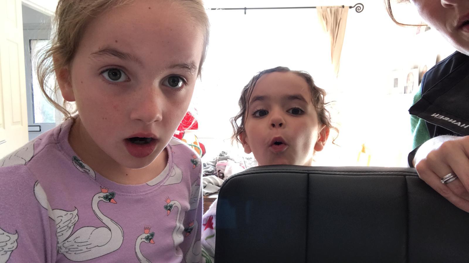 Bethany (8yo) & Amelie (5yo) watching a video Pip sent to them of dolphins playing around Superbigou.