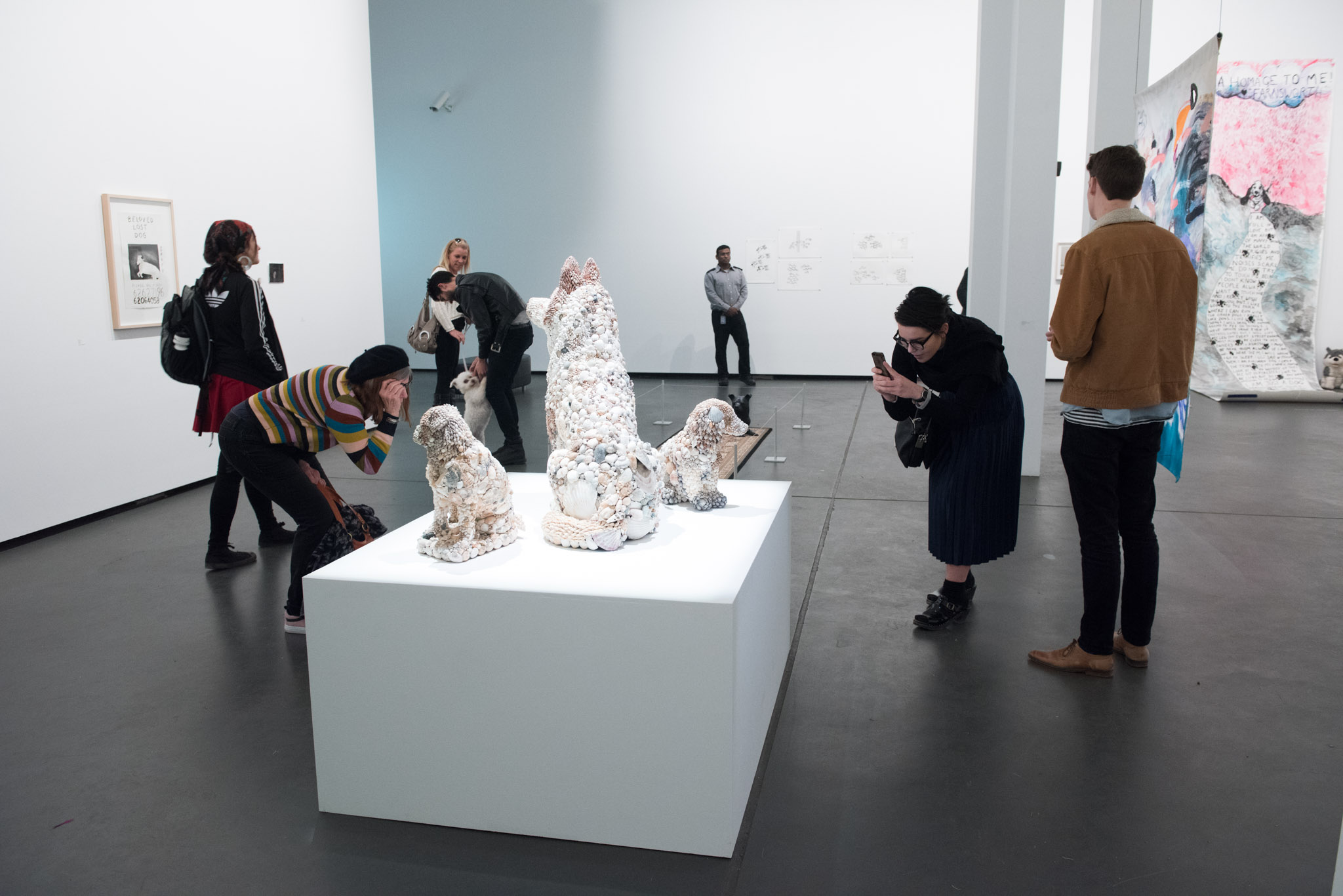 Visitors at the exhibition launch, Every Dog Will Have its Day, 2017, Casula Powerhouse Arts Centre, Sydney. Photo: Hamish Ta-Me