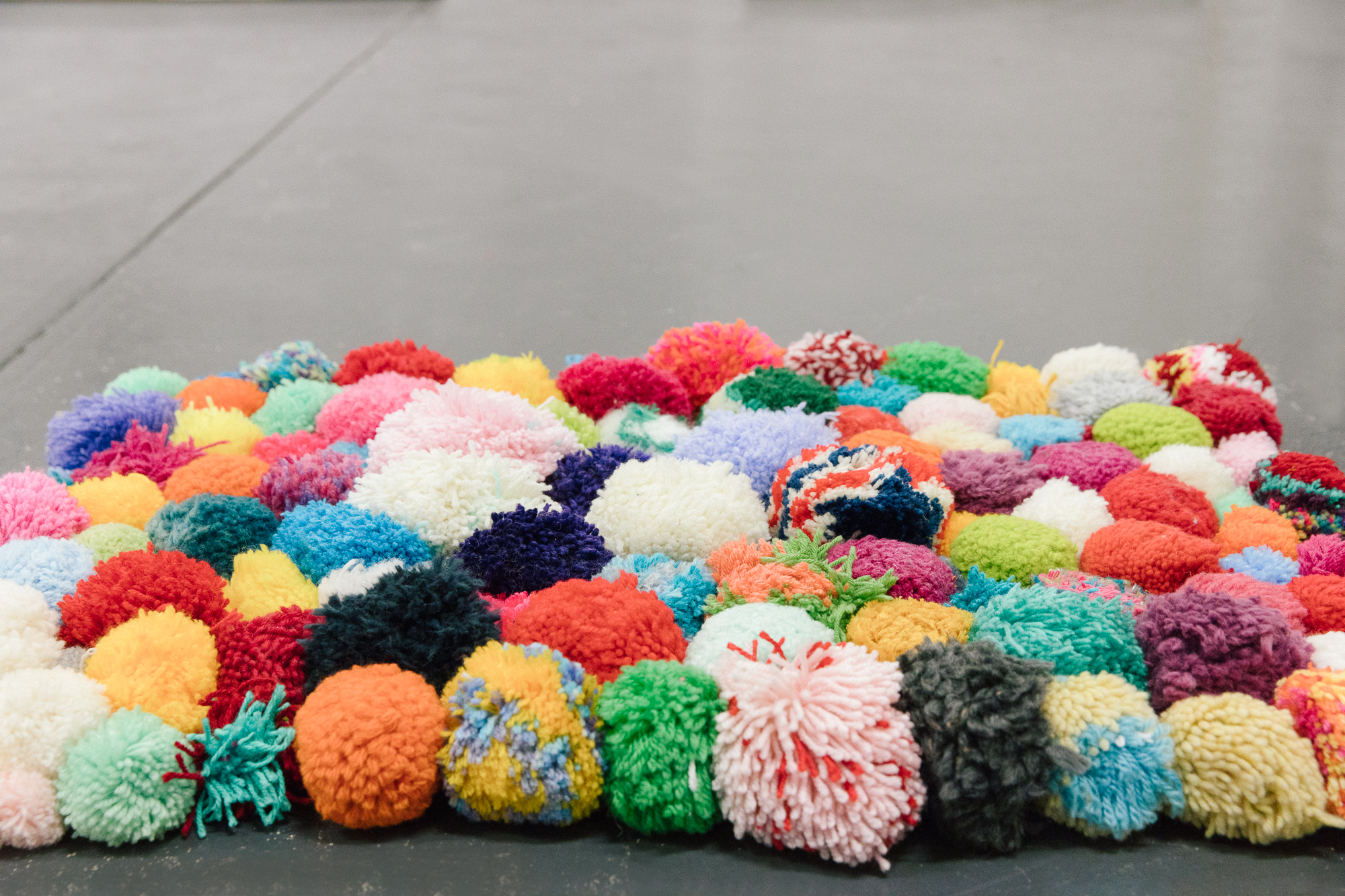  Pip Lincolne, pom-pom rug, installation view,  Handle With Care,  2018, Soul Craft Festival, Melbourne. Photo courtesy Soul Craft Festival. 