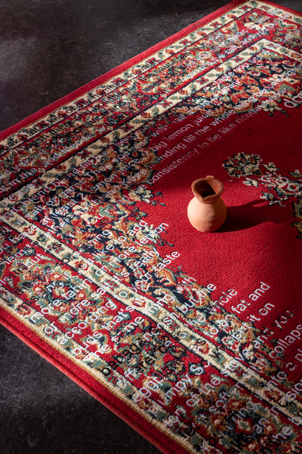  Lara Chamas,  have you assimilated yet?  2016 work, 2021 performance, screen printed flock on polypropylene rug, bleach, performance, 160 x 225 cm, installation view,  Disobedient Daughters,  Counihan Gallery, 2021. Photo: Janelle Low 