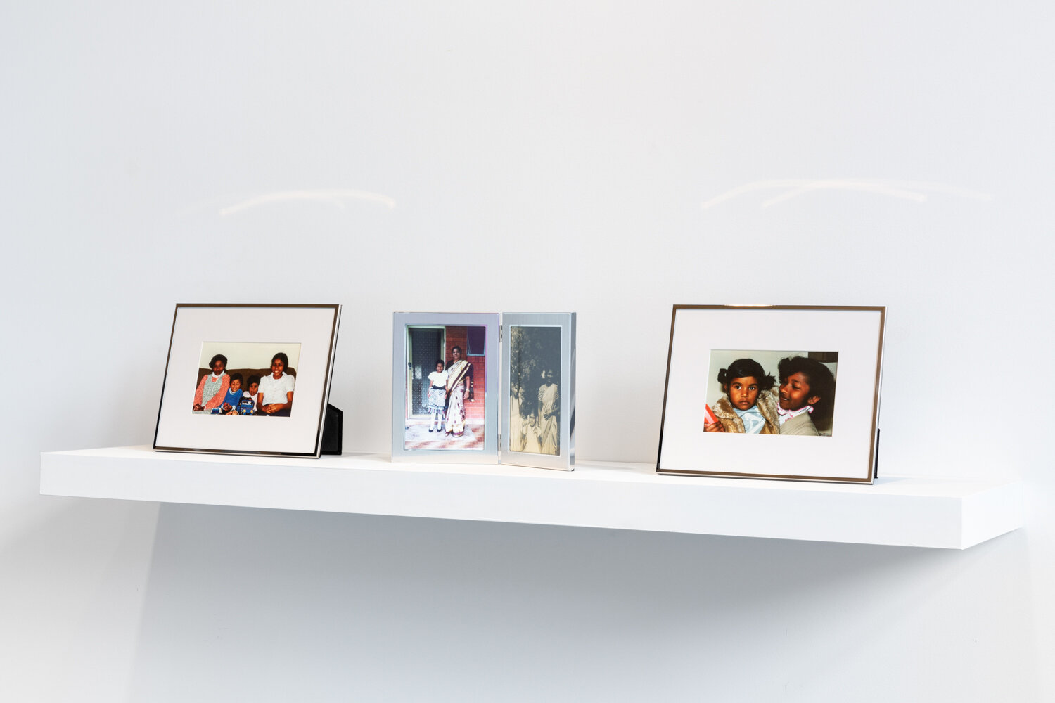  Shivanjani Lal, Family Photo Albums of the Lal and Arumugam families, black and white photos late 1950s, colour photographs 1985 – 1988, 10 x 15 cm, installation view,  Disobedient Daughters,  Counihan Gallery, 2021. Photo: Janelle Low 