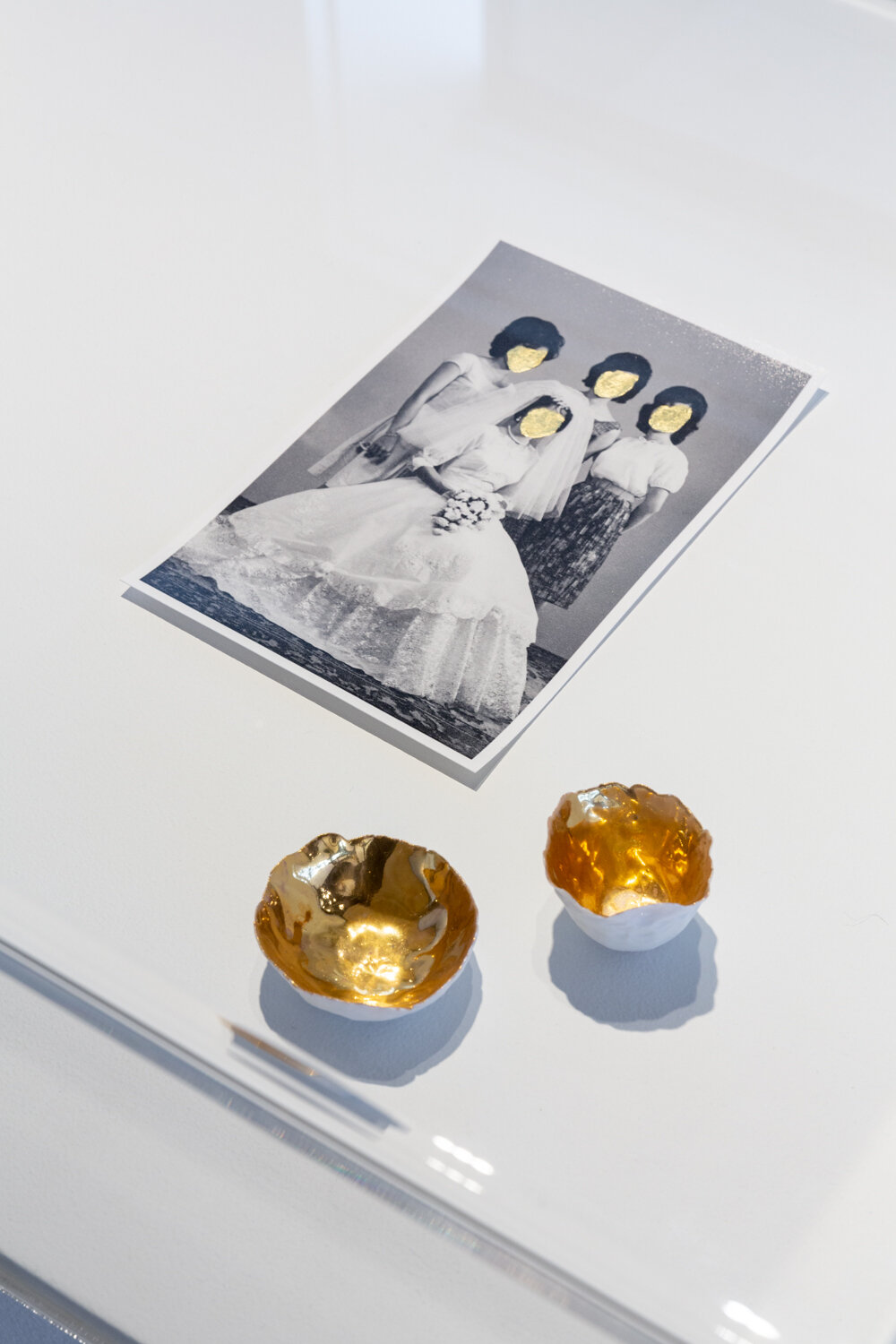  Janelle Low ,   At Your Surface,  pigment inkjet print and gold leaf, porcelain and gold lustre, prints 23 x 15 cm, cups dimensions variable, installation view,  Disobedient Daughters,  Counihan Gallery, 2021. Photo: Janelle Low 