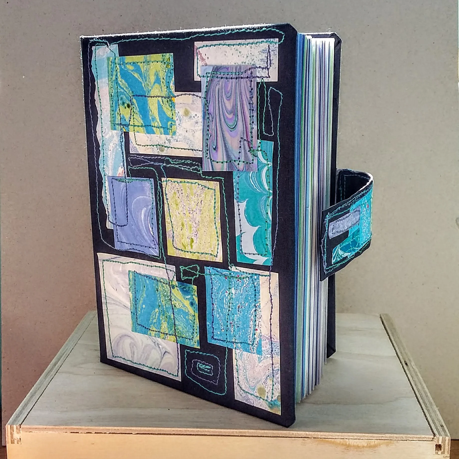 Blue marbled book with magnet closure A6 size. 11.5 x 15.5 cm. 140 sides, 70 pages. £30 plus p&p