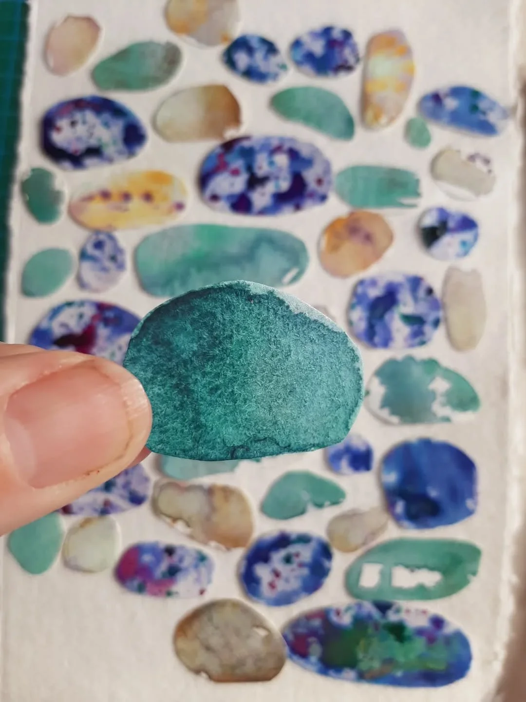 I've been playing with pebbles recently when I've been demonstrating at local Art and Crafts events. I love pebbles. Collecting pebbles from a beach. The feel of a pebble in your hand. Worn smooth by years of being ocean-tossed. 
These vibrant colour