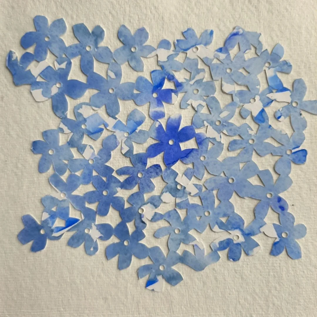 Day 49 of #DoThe100DayProject 
@dothe100dayproject 
Isn't it beautiful? And so simple. 
One piece of painted paper. Simple Vinca type flowers drawn on the back, interconnected. 
Cut out with a scalpel and the centres punched out.
I love the movement 