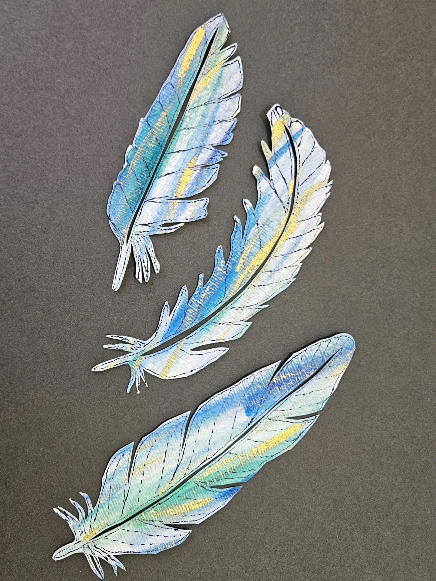 Three lovely paper #Feathers mounted together. 
I wonder what the bird looks like that these come from? 🐦 
I had thought I'd mount them onto gold but this black background makes them stand out much more. 
Wrapped and now available in #WetherbyGaller