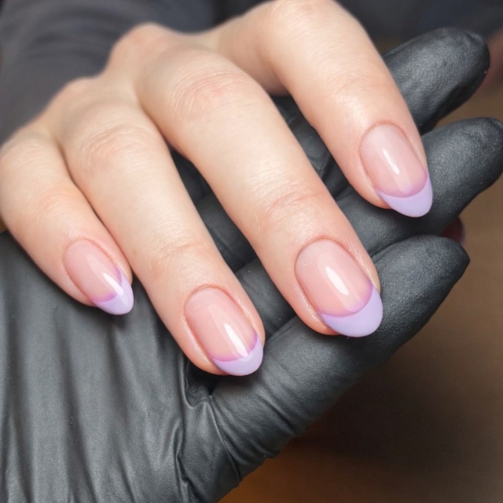 Gorgeous lilac French with an undertone purple fade 😮&zwj;💨 client is all set for her January Holibobs ☀️ 

GelPot 3 (Hard Gel) 
Boutique &amp; In Bloom (TGB) 

#nails #frenchnails @scratchmagazine #nailinspo #springnails #holidaynails