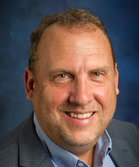 DJC Head shot Cropped.jpeg