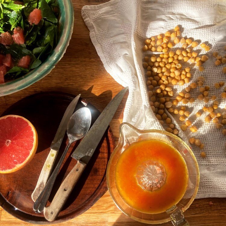 Winter sun, a spinach and grapefruit salad, chickpeas drying before going into the oven