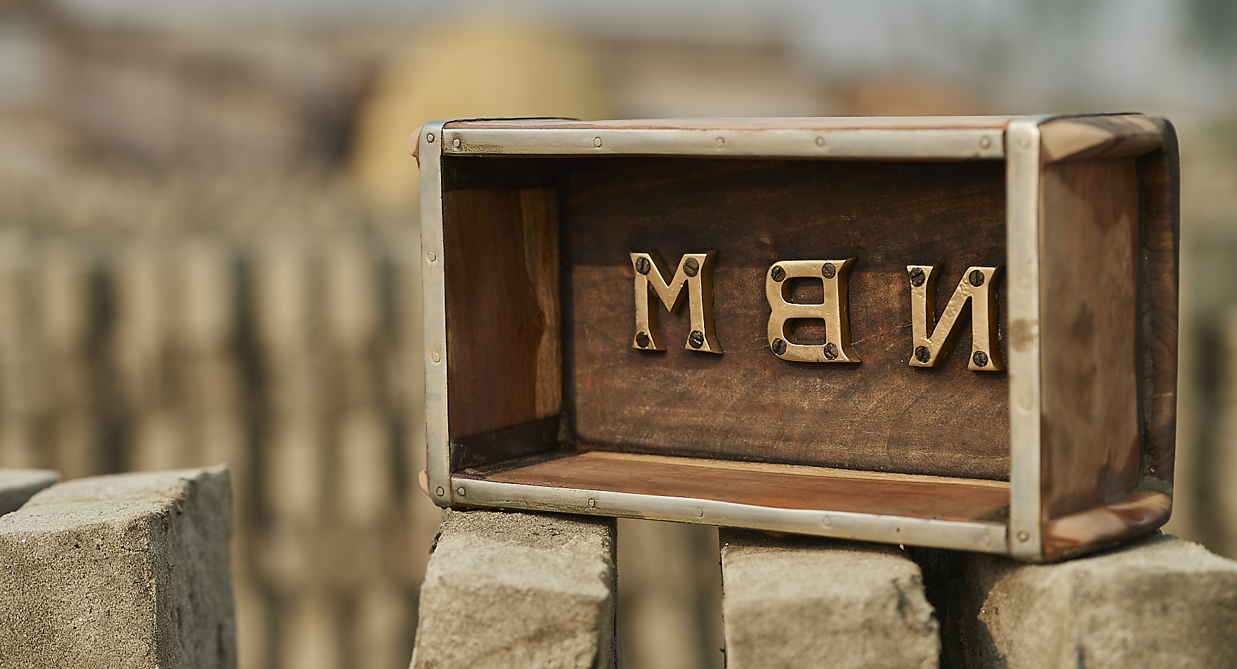 a brick mould with the factory name embossed in brass