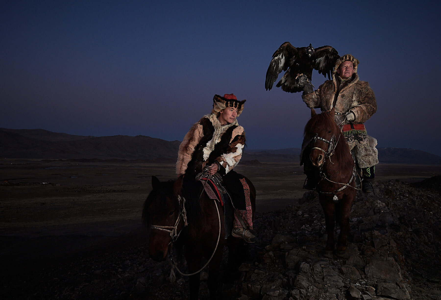 Bashakan and his son, two generations of legendary eagle hunters