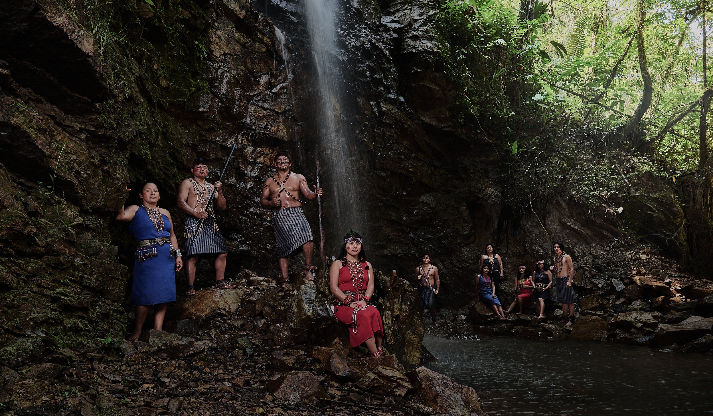 Members of the Shuar tribe at the sacred Kinthia Panti (meaning anaconda) waterfall