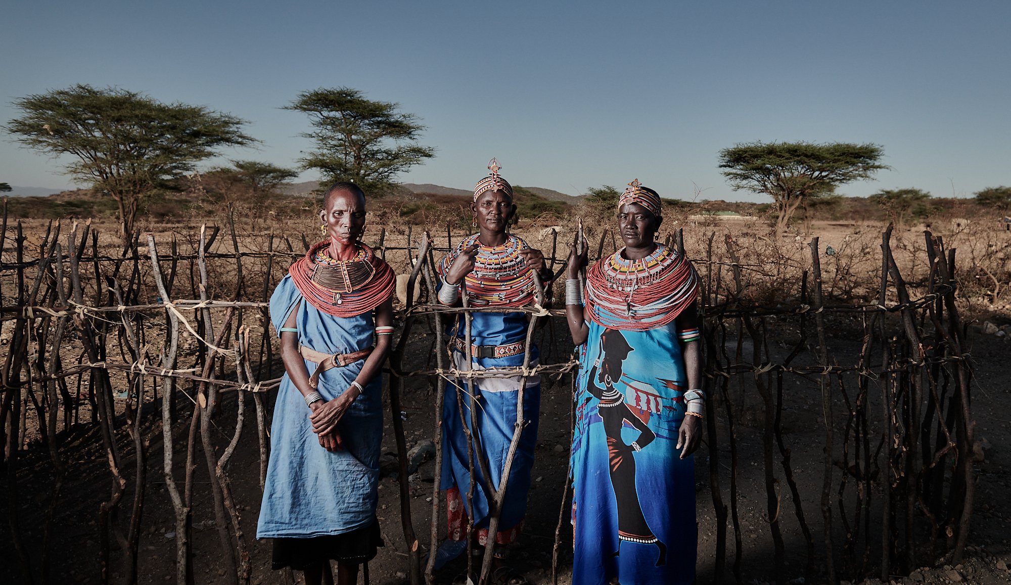 Women of the Samburu tribe around a small goat pen
