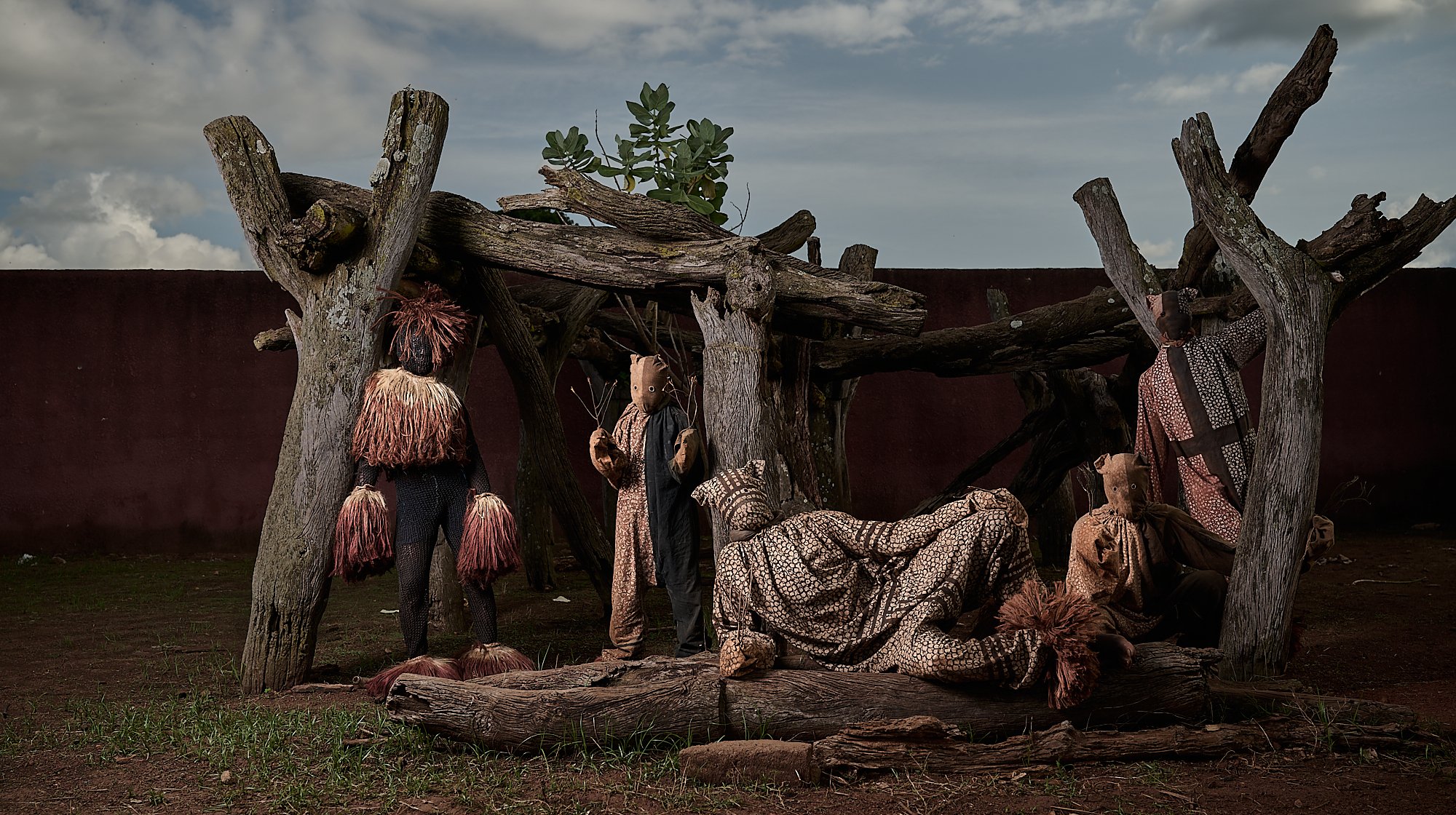 Sacred panthers posing in front of their sacred community structure