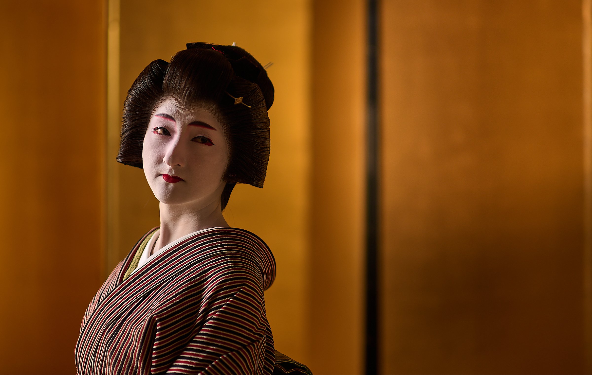 Geishas are the epitome of elegance and grace in everything they do, even a simple tilt of the head