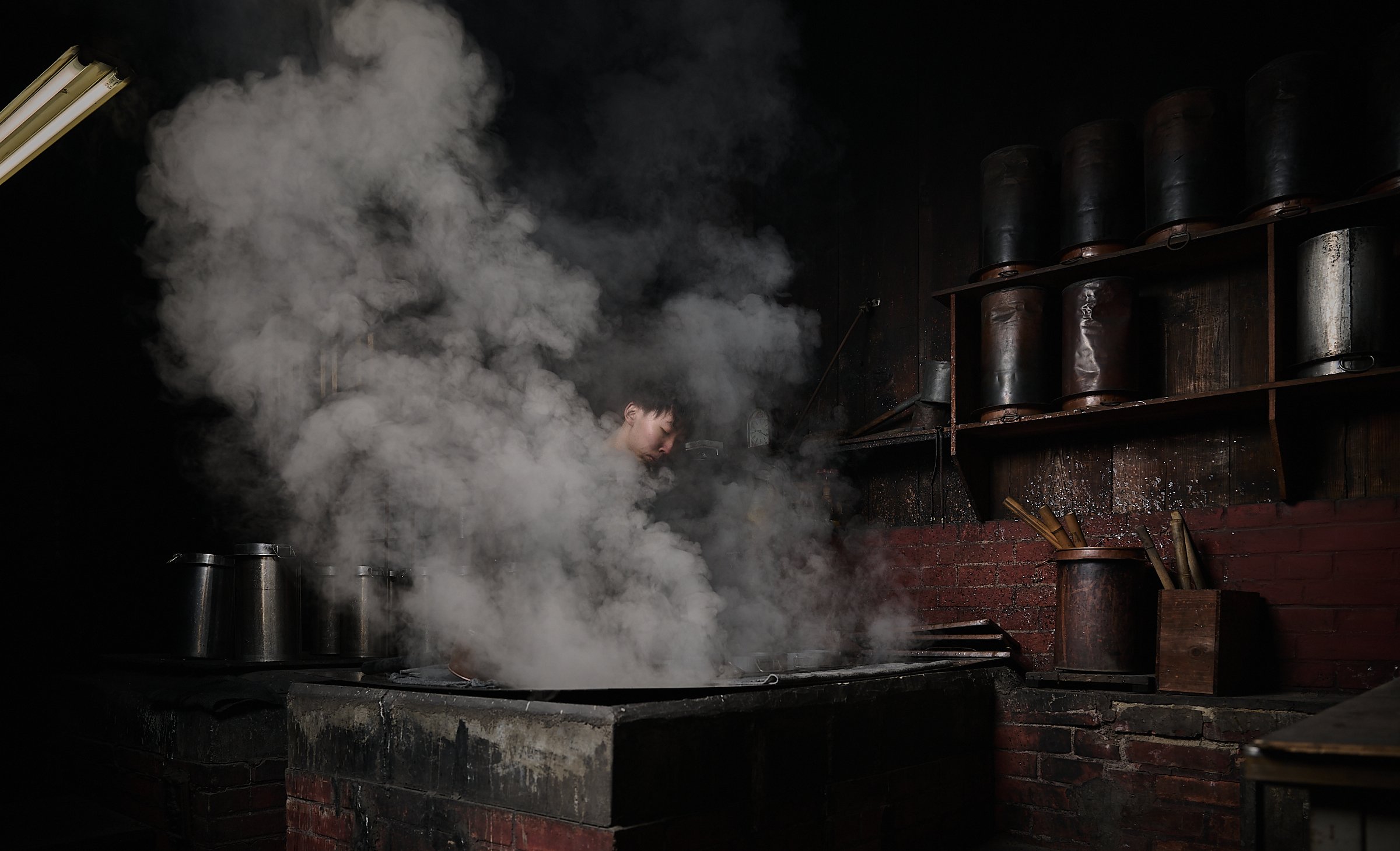 Mr Hashiwada, one of the experts in the Kobaien ink stick factory, mixing the glue which will become ink