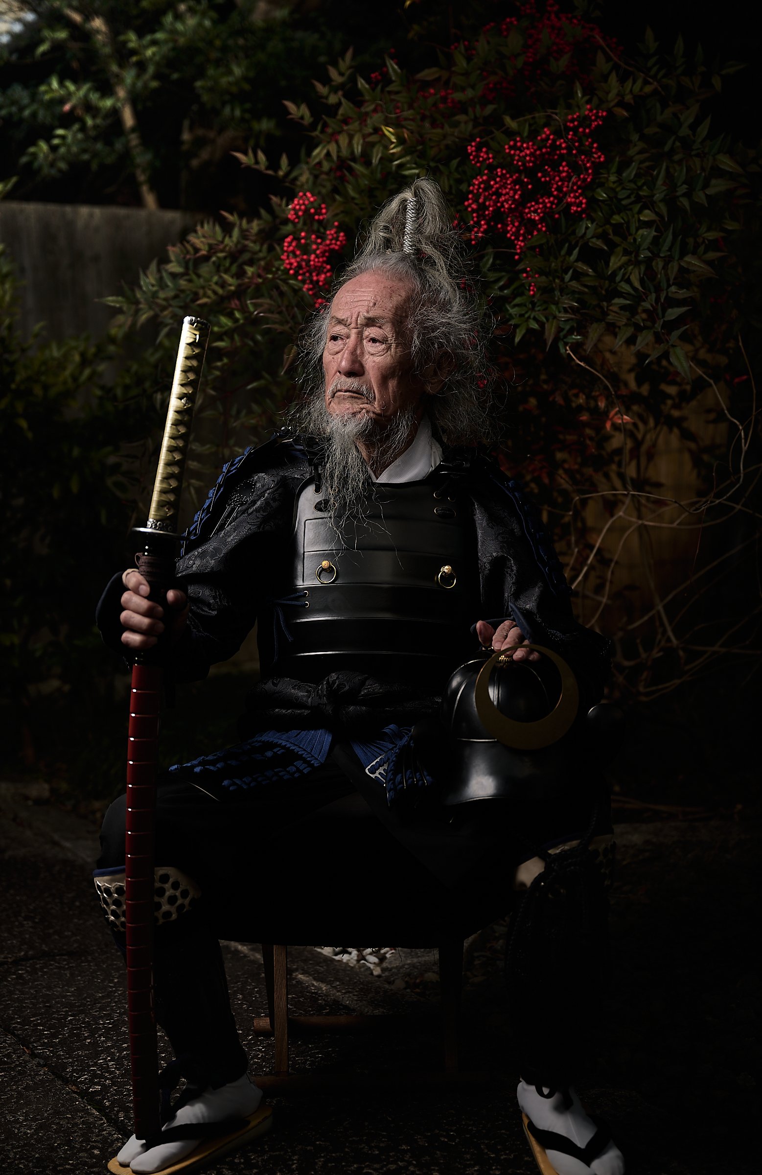 Okada-san, one of the last remaining samurai wearing the traditional armour, holding a duelling katana