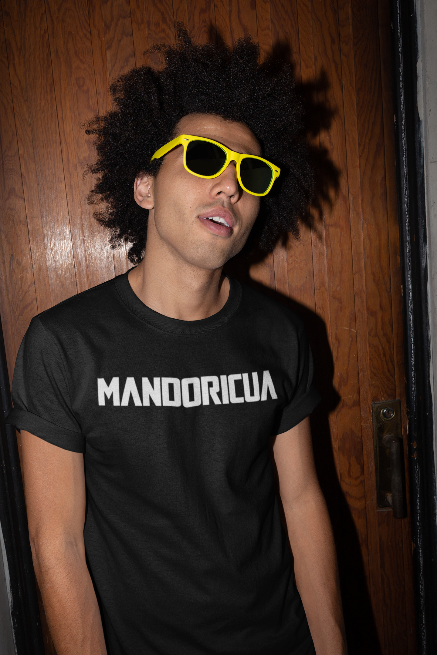 tshirt-mockup-of-a-man-with-sunglasses-against-a-wooden-door-22298.png