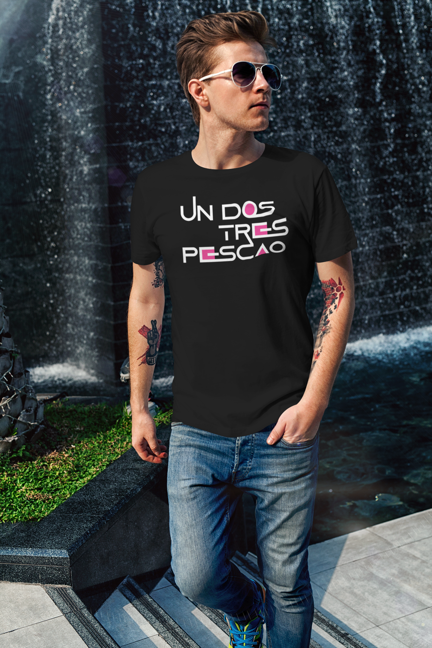 t-shirt-mockup-of-a-cool-man-walking-by-a-fountain-2190-el1.png