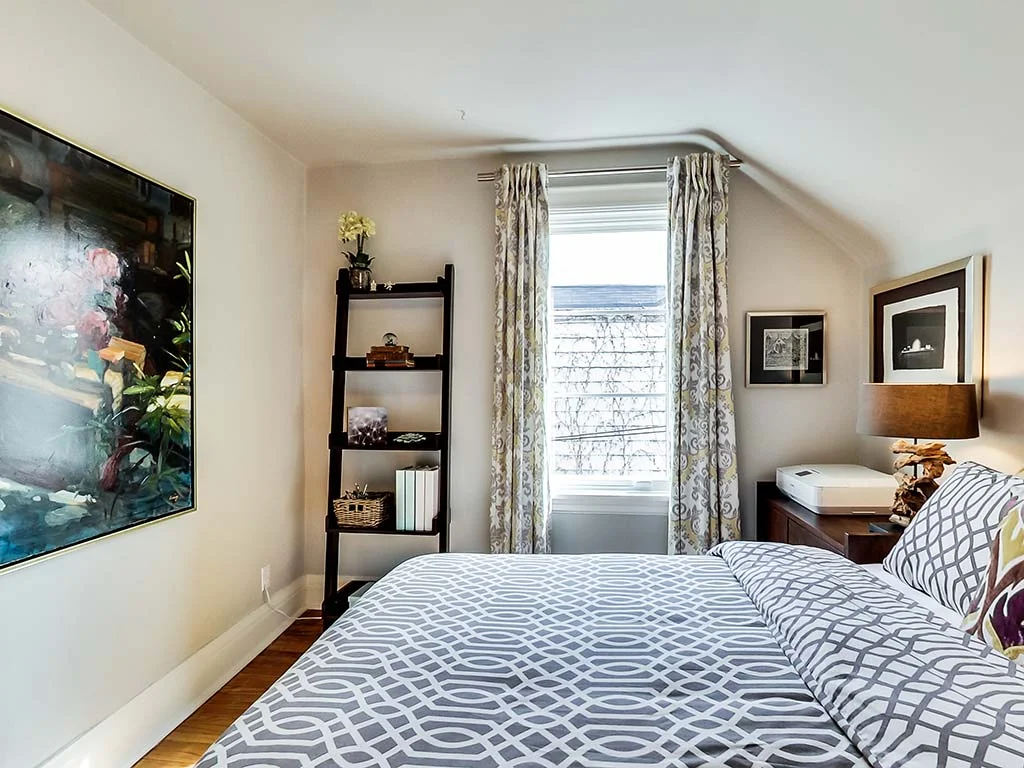 Second bedroom with window and double bed