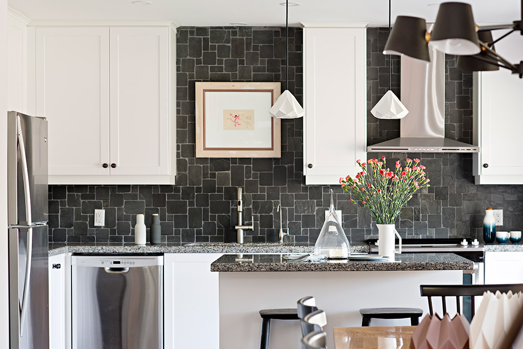 Shade of grey rustic kitchen backsplash.