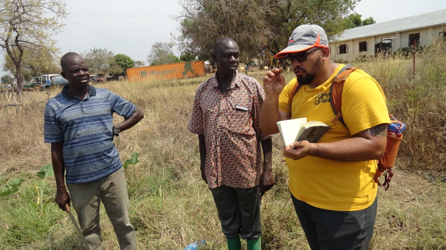 Bryan discussing farm mapping with Peter Lomago (director at HFSS) and Antony Lolik (deputy director)