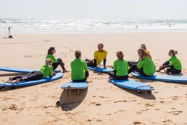 Group beginner surf lessons on our retreats