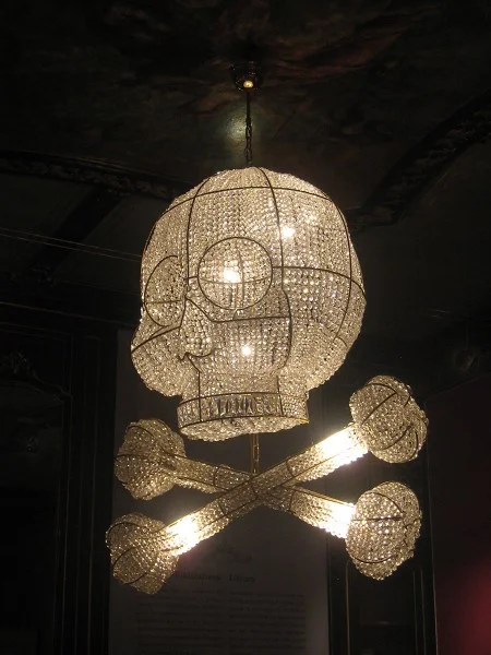 Skull and Crossbones Chandeliers made by the Rotterdam artist Hans van Bentem. The artist designed these especially for the museum, with some references to the work of Escher and the Palace.