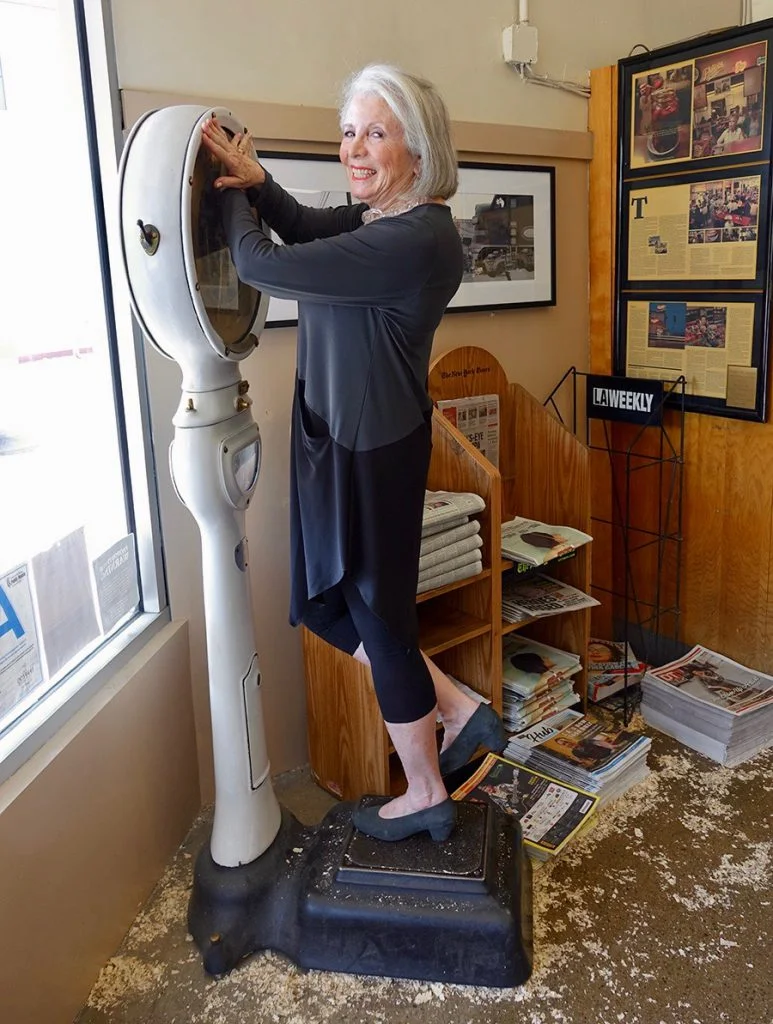 Sandra on an old scale at Philippe's Restaurant