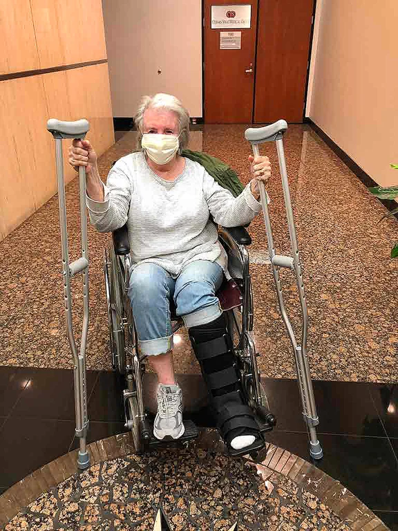 Sandra with crutches and wheelchair in Urgent care