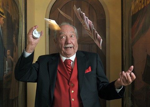 Milt Larsen performing card tricks.