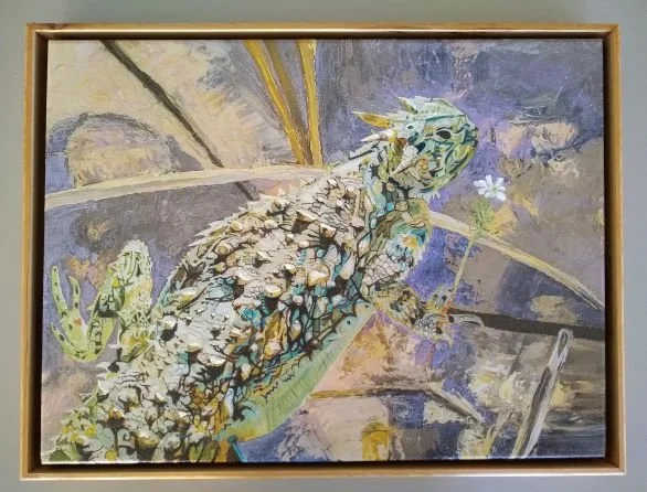 Desert lizard with flower.jpg
