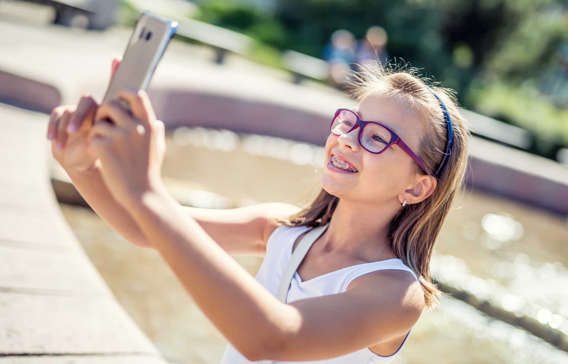 little-girl-taking-a-selfie-with-braces-mirror.jpg
